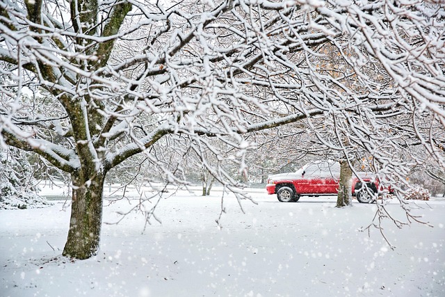 A red truck in the snow symbolizes choosing the right factoring company.